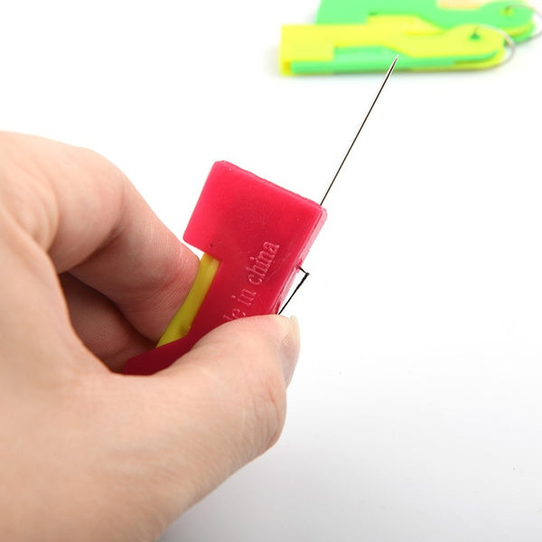 Multicolour automatic needle threading device with a needle inserted Multicolour automatic needle threading device with a needle inserted